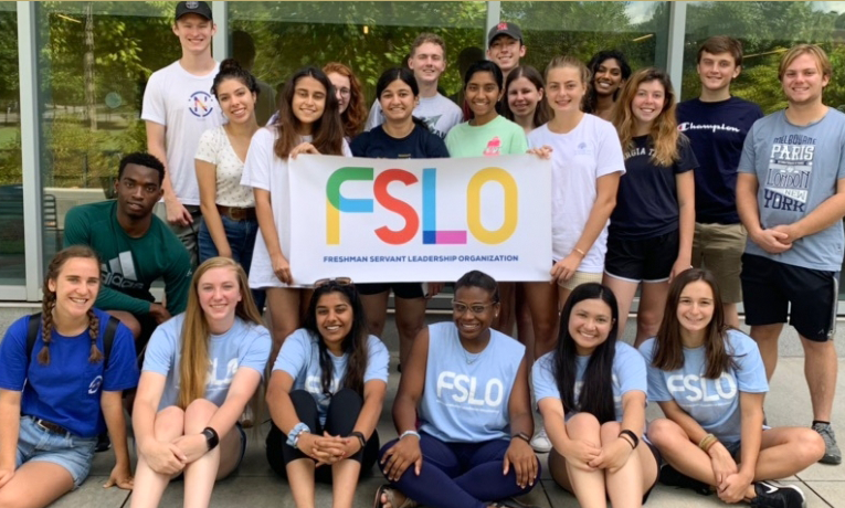 Group of students with a banner that reads FSLO.