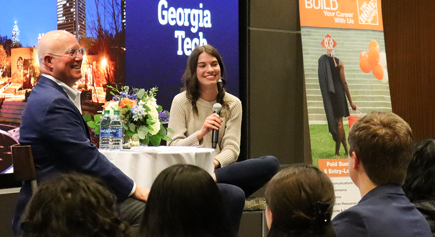 During the Home Depot event the founder and a student moderator sit in front of an audience.